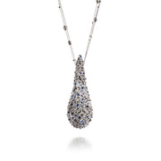 Todd Reed necklace in 22k yellow gold, palladium, platinum, moldavite(~76.03ct), fancy cut diamonds(~24.51ct), brilliant cut diamonds(~.42ct), rose cut diamonds(~4.74ct), sapphires(~17.34ct), and blue moonstone(~39.34ct).
